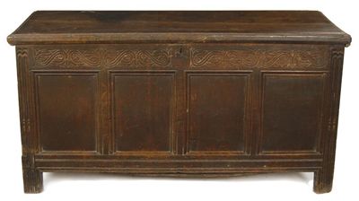 Appraisal: A late th century oak chest the boarded top with