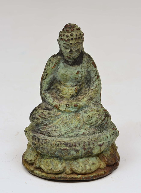 Appraisal: A SMALL CHINESE BRONZE BUDDHA with verdigris possibly Swat Valley