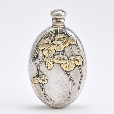 Appraisal: TIFFANY CO JAPANESQUE PARCEL GILT SILVER FLASK Oval spot-hammered with