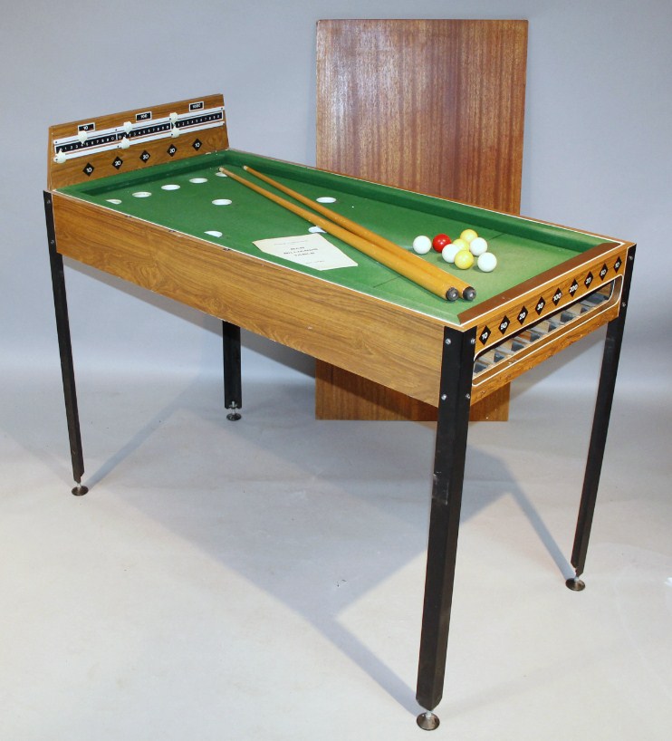 Appraisal: A retro teak bar billiards game with shaped rectangular top