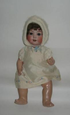 Appraisal: An Ernst Heubach bisque head girl doll with blue glass