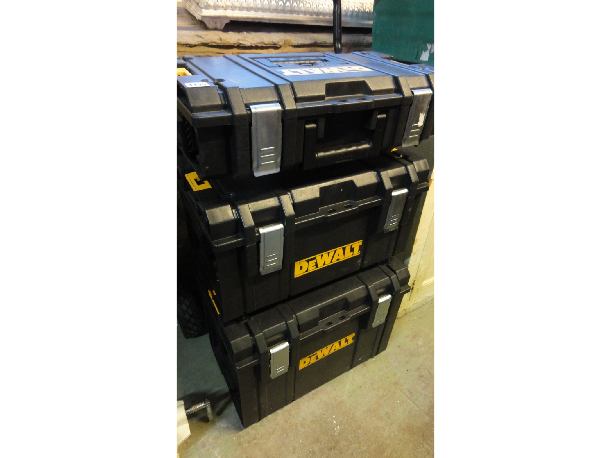 Appraisal: A Dewalt Tough System trolley with three moulded plastic removable