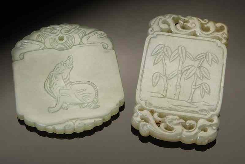 Appraisal: Chinese Qing carved jade pendants depicting bamboo and flowers ''H