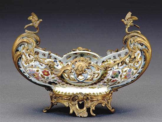 Appraisal: Continental ormolu mounted porcelain centerpiece late th centuryreticulated and enamel