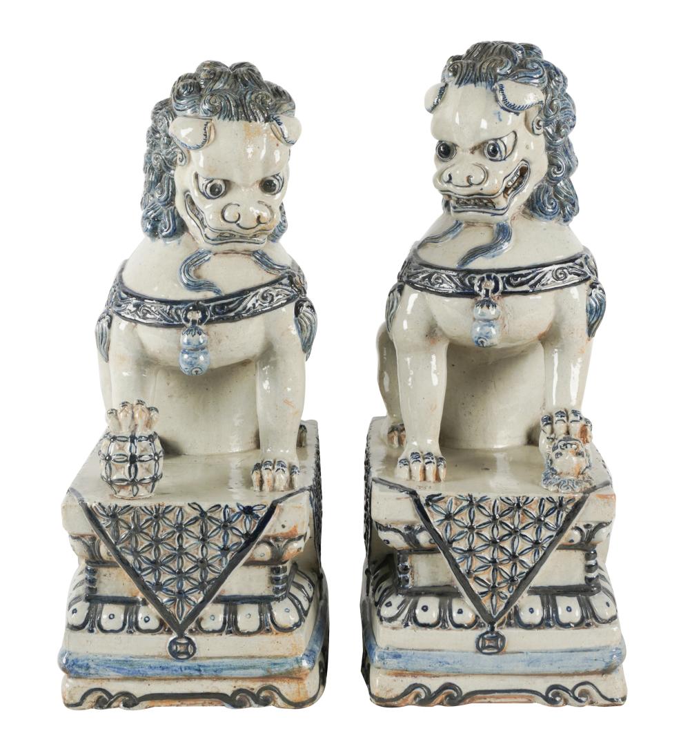 Appraisal: PAIR OF CHINESE BLUE WHITE CERAMIC FOO DOGSunsigned inches wide