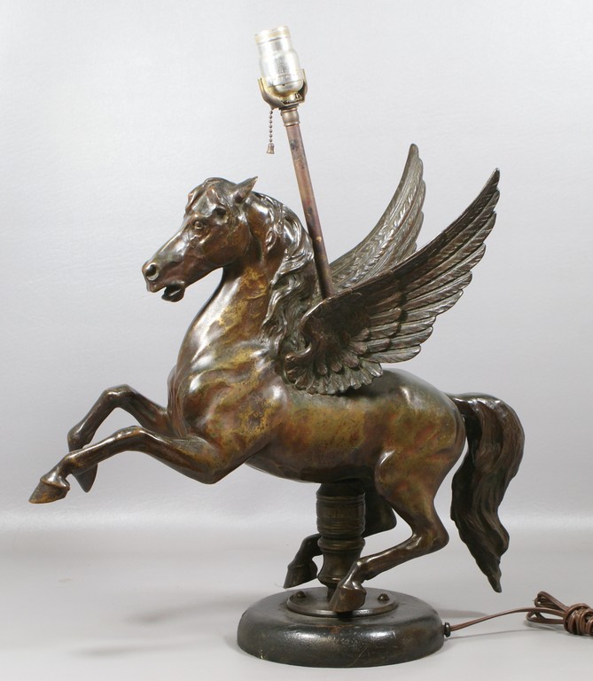 Appraisal: Solid cast bronze Flying A Pegasus sculpture mounted as a