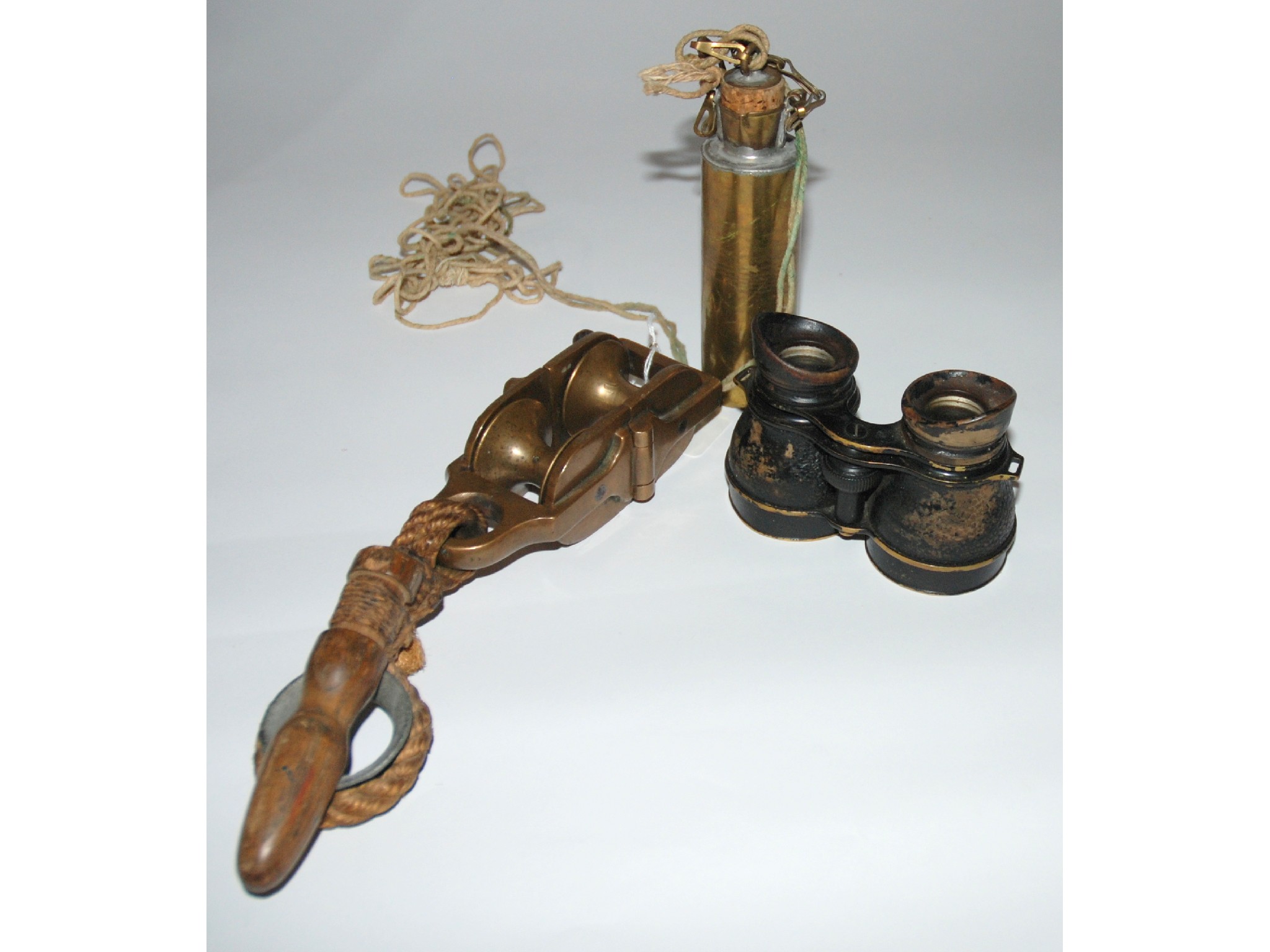 Appraisal: A pair of binoculars brass snatch block and lifeboat dipper