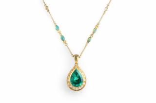 Appraisal: A Gold Emerald Pendant Necklace Suspending one central emerald weighing