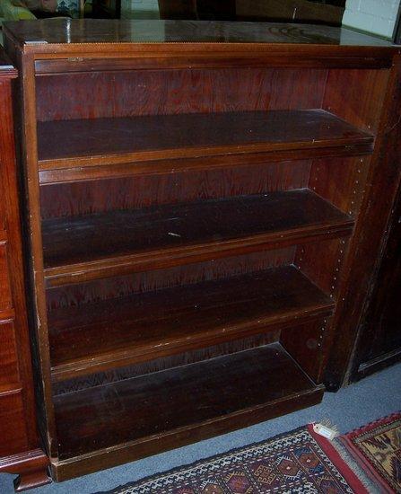 Appraisal: An Edwardian mahogany bookcase the rectangular top with chequer strung