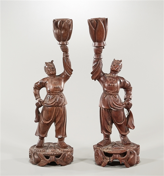 Appraisal: Pair of Chinese carved wood figures standing on openwork pedestals