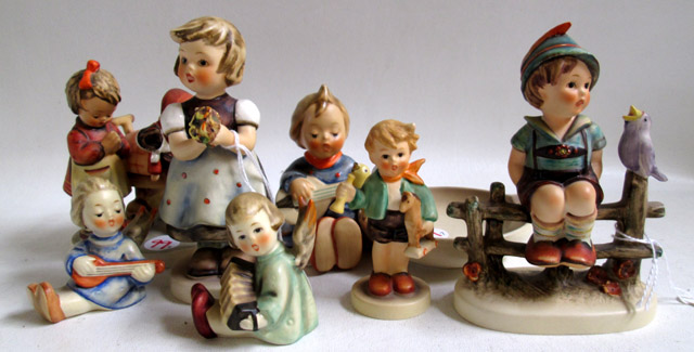 Appraisal: SEVEN HUMMEL FIGURINES soft paste porcelain Doll Mother HUM TM-