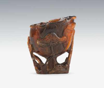 Appraisal: A Carved and Polished Horn Libation Cup In the form