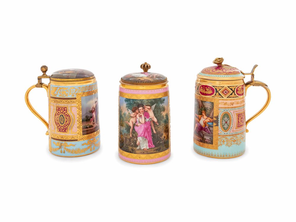 Appraisal: Three Vienna Painted and Parcel Gilt Porcelain Tankards Three Vienna