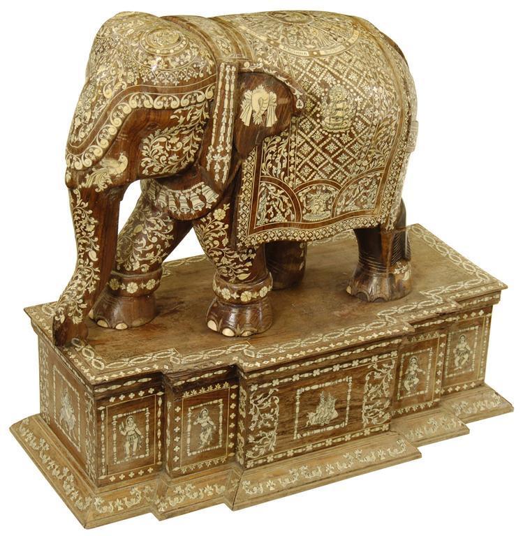 Appraisal: An Indian carved rosewood and ivory inlaid elephant