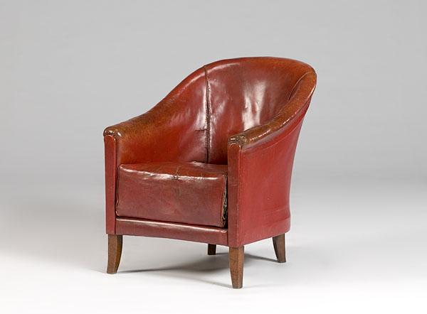 Appraisal: FRENCH CLUB CHAIR IN RED LEATHER ca - a barrel-back