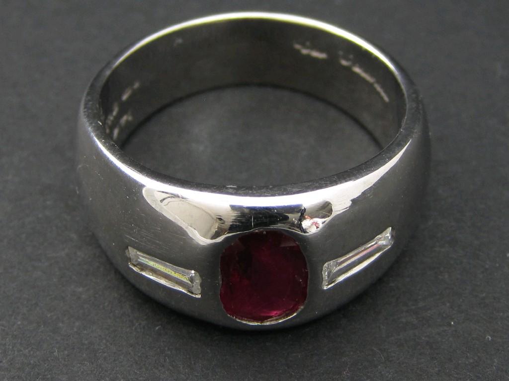 Appraisal: A Gentleman's Contemporary Ruby and Diamond Ring gypsy-set oval-cut ruby