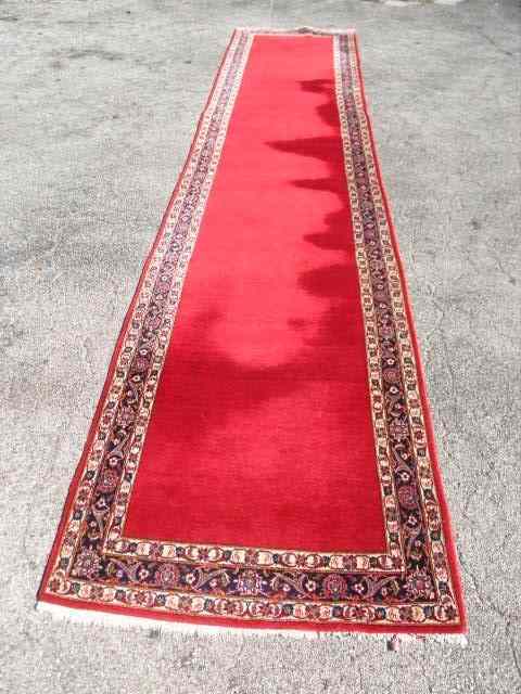 Appraisal: Oriental red runner Measures feet long x feet wide Floral