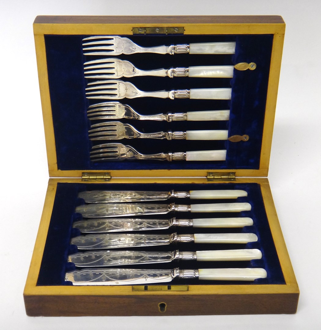 Appraisal: A set of six pairs of plated fish knives and