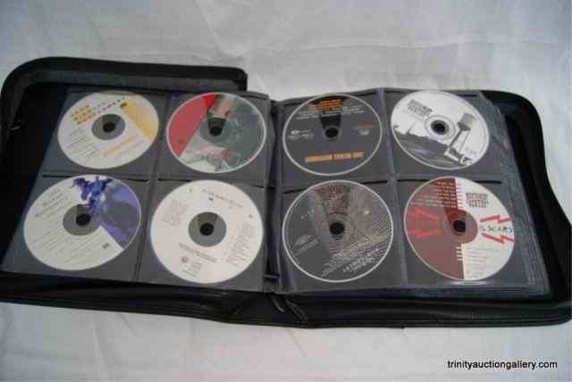 Appraisal: Country Western Music CD's in Leather Case Includes modern era