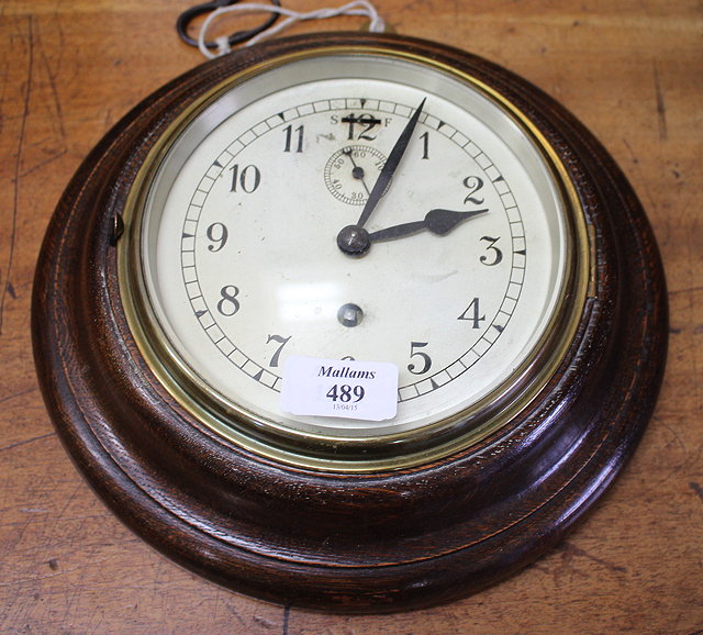 Appraisal: A CIRCULAR OAK CASED WALL CLOCK silvered dial with Arabic