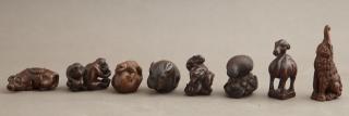 Appraisal: Group of Eight Carved Wood Netsukes th c in t