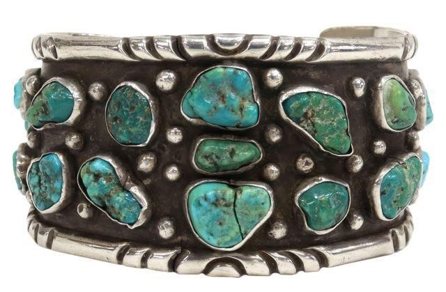 Appraisal: Native American silver content unknown cuff bracelet fitted with seventeen