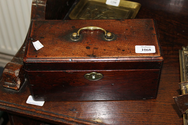 Appraisal: A GEORGIAN MAHOGANY TEA CADDY with brass handle opening to