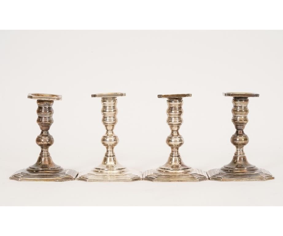 Appraisal: Set of four sterling silver weighted candlesticks in the Chippendale