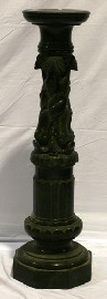 Appraisal: A carved pedestal in verde marble and featuring scrolled stylised