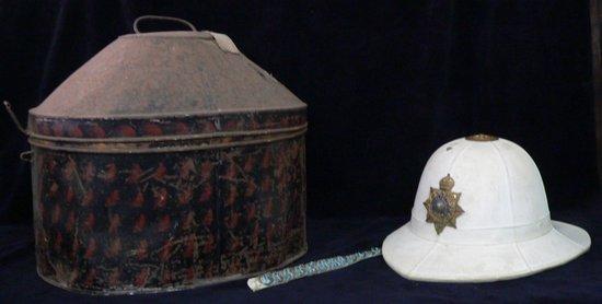 Appraisal: A tin trunk containing a pith helmet