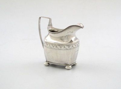 Appraisal: A George III provincial silver cream jug of oblong tapering