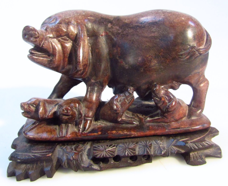 Appraisal: A thC polished hard stone figure of a sow and