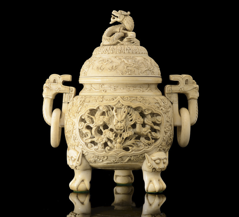 Appraisal: DRAGON MOTIF CHINESE CARVED IVORY CENSOR Ornately carved with dragon