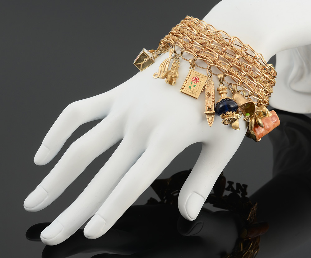 Appraisal: K CHARM BRACELET WITH CHARMS K yellow gold charm bracelet