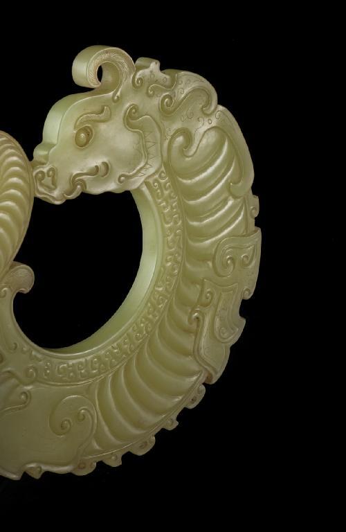 Appraisal: A MAGNIFICENT CHINESE YELLOW JADE PENDANT carved as an archaistic