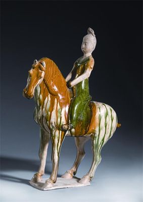 Appraisal: A Chinese sancai-glazed pottery model of a female equestrian raised