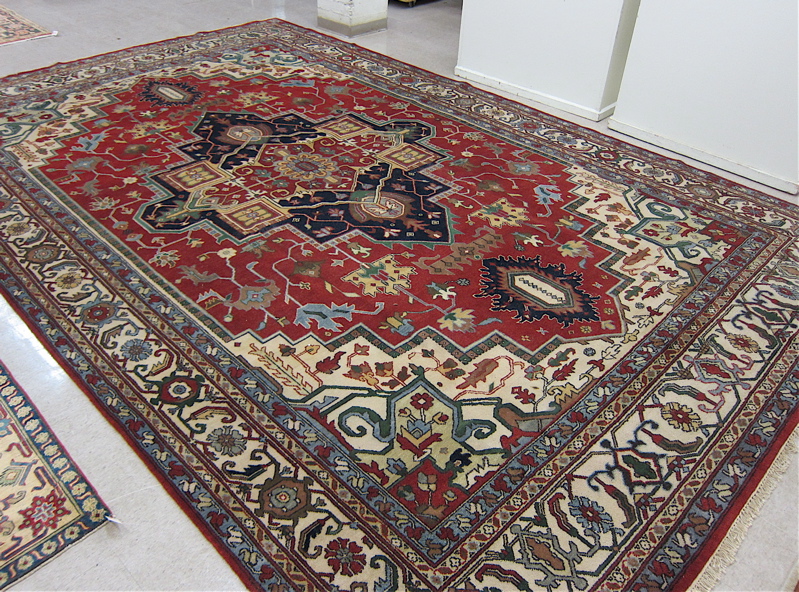 Appraisal: HAND KNOTTED ORIENTAL CARPET Northwest Persian Serapi design a distinct