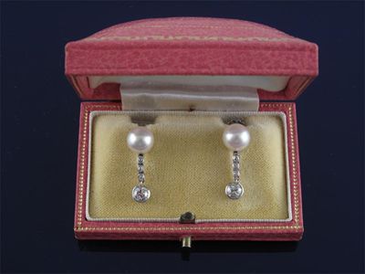 Appraisal: A pair of cultured pearl and diamond drop earrings White