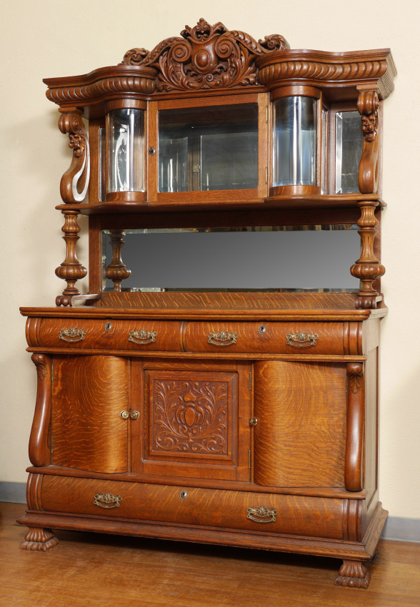 Appraisal: HIGH VICTORIAN ENGLISH OAK SIDEBOARD CABINET Shaped pediment carved center