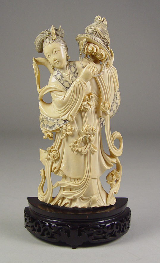 Appraisal: Carved Ivory Figure of a Lady with Flower Basket Circa