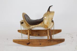 Appraisal: Leather and rawhide saddle on rocking horse Western leather and