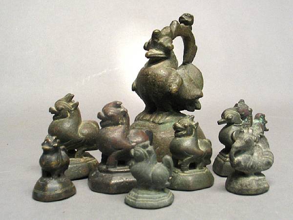 Appraisal: An assembled group of fourteen Burmese metal weights Including birds