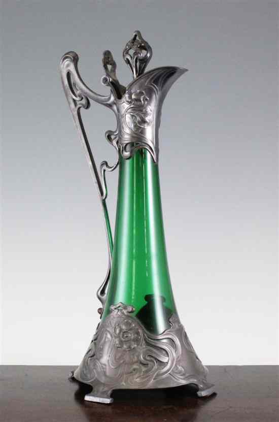 Appraisal: A WMF Art Nouveau pewter mounted green glass claret jug