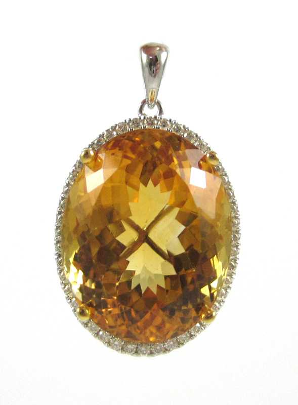 Appraisal: CITRINE AND FOURTEEN KARAT GOLD PENDANT The white and yellow