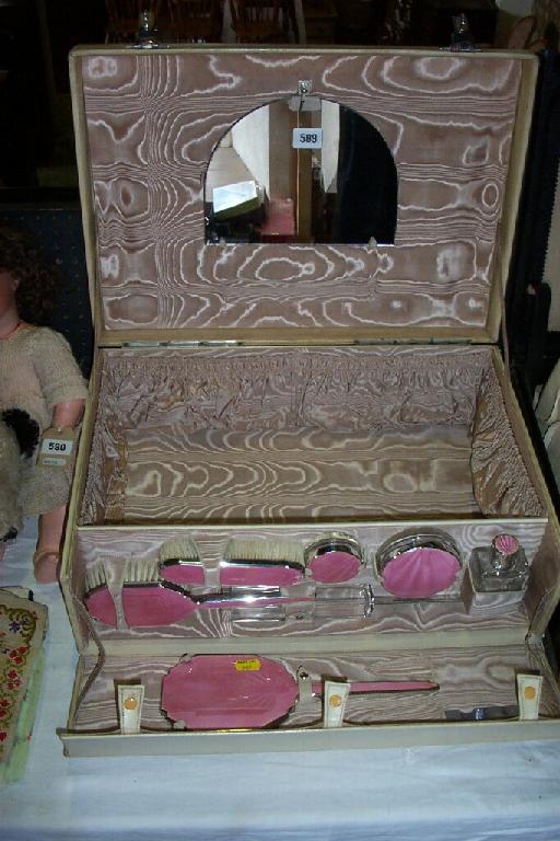 Appraisal: A vellum dressing case containing a collection of glass and