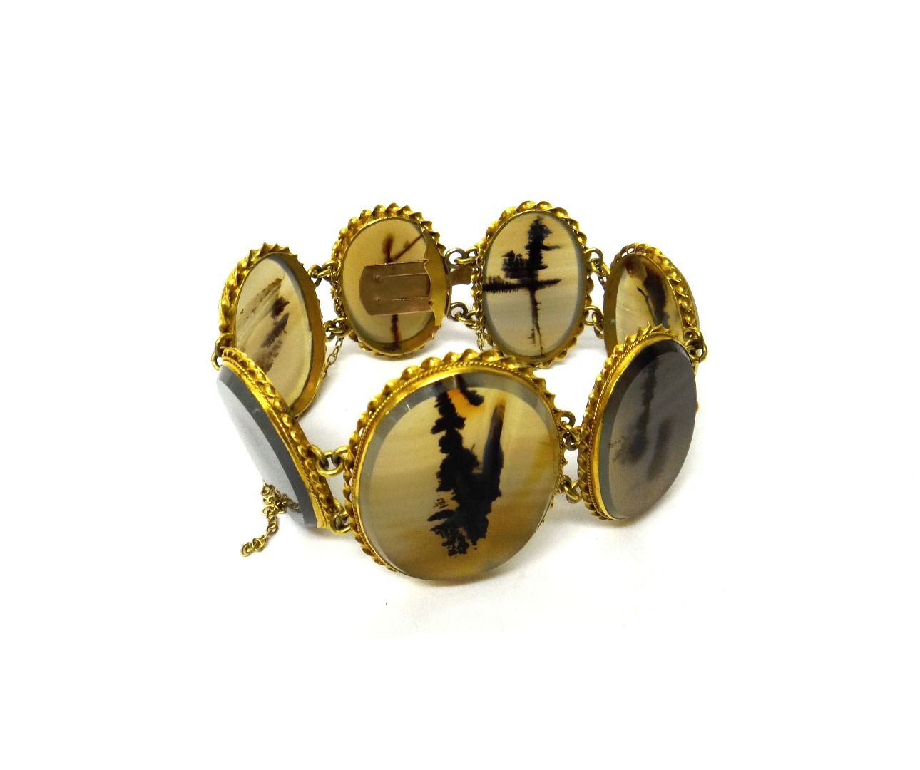 Appraisal: A gold mounted agate set panel link bracelet mounted with