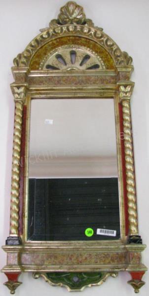 Appraisal: A Decorator wall mirror with silvered carved and molded frame