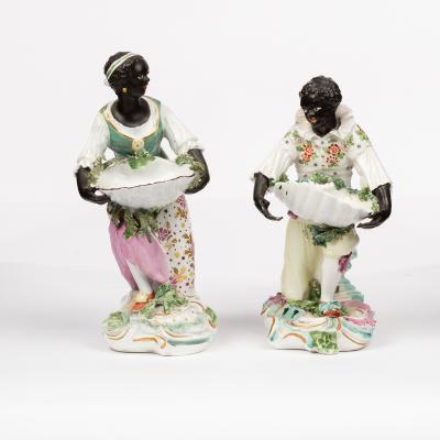 Appraisal: Two Derby blackamoor sweetmeat figures circa - each modelled holding