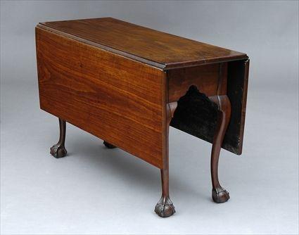 Appraisal: GEORGE III WALNUT GATE-LEG TABLE The rectangular top with molded