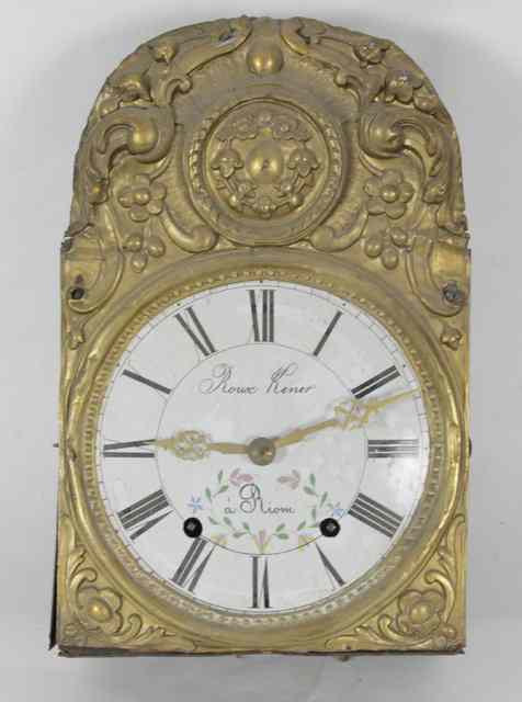 Appraisal: A French wall clock with embossed brass surround fitted a